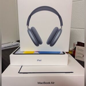 Apple AirPod Max , Apple laptop, iPod. Empty boxes